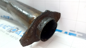 The Subaru Outback 15-18 exhaust pipe with catalytic converter is rusty.