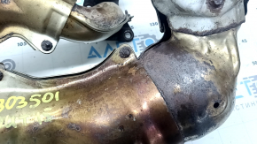 Rusty exhaust manifold with catalytic converter for a Subaru Outback 15-19