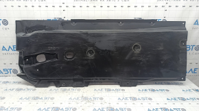 The front left underbody protection of the Mazda 3 19-24 is worn out.