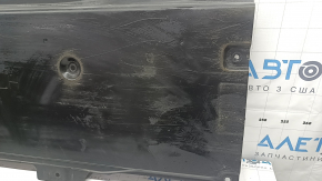The front left underbody protection of the Mazda 3 19-24 is worn out.