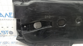 The front left underbody protection of the Mazda 3 19-24 is worn out.