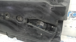The front right underbody protection of a Mazda 3 19-24 is worn out.