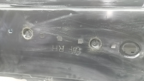 The front right underbody protection of a Mazda 3 19-24 is worn out.