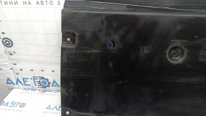 The front right underbody protection of a Mazda 3 19-24 is worn out.