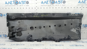 The front right underbody protection of a Mazda 3 19-24 is worn out.