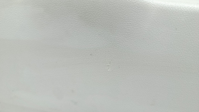 Upper plastic trim on the trunk door of a Lexus RX300 RX330 RX350 RX400h 04-09, gray, scratches, and whitened plastic