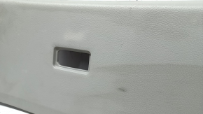 Upper plastic trim on the trunk door of a Lexus RX300 RX330 RX350 RX400h 04-09, gray, scratches, and whitened plastic