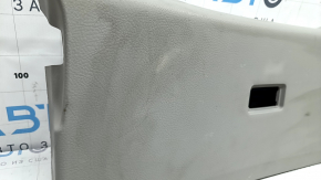 Upper plastic trim on the trunk door of a Lexus RX300 RX330 RX350 RX400h 04-09, gray, scratches, and whitened plastic