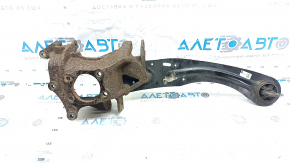 The rear left axle of a Ford Escape MK3 13-19 with a trailing arm is rusty.