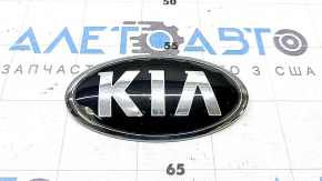 The KIA emblem badge on the front bumper of the Kia Niro 17-22 has swollen paint.