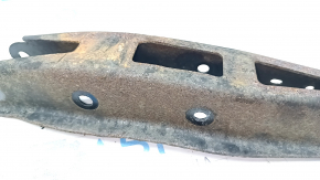 The lower rear left control arm of a Subaru Outback 15-19 is rusty.