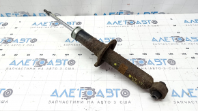 The rear left shock absorber for a Subaru Outback 15-17 is rusty.