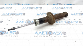 The rear right shock absorber of a Subaru Outback 15-17 is rusty.