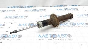 The rear left shock absorber for a Subaru Outback 15-17 is rusty.