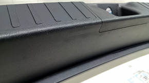 The trunk opening trim for a Toyota Prius 50 16-22 is black, worn, and has scratches.