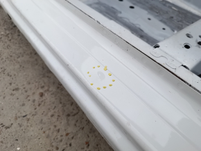 Front left quarter panel of Mazda 3 19-24, white, on the body, bumps