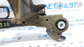 The rear subframe of a 1919 Subaru Outback is rusty.