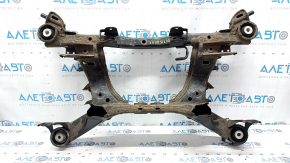 The rear subframe of a 1919 Subaru Outback is rusty.