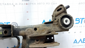The rear subframe of a 1919 Subaru Outback is rusty.