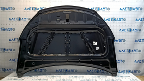 The bare hood of a Hyundai Santa FE Sport 13-18 steel, dents