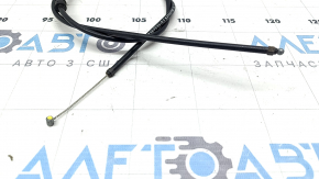 The rear hood release cable of a BMW X5 F15 14-18 has a torn seal.