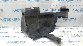 The front right rear fender liner of a BMW X5 F15 14-18 is dented and the fastener is torn.