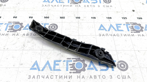 The left front bumper mount for a Toyota Camry V55 15-17 USA has a broken latch.