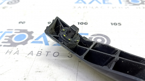 The left front bumper mount for a Toyota Camry V55 15-17 USA has a broken latch.