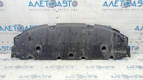 The front bumper guard of a Toyota Prius 50 16-18 is worn, scuffed, and the fastening is broken.