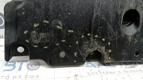 The front bumper guard of a Toyota Prius 50 16-18 is worn, scuffed, and the fastening is broken.