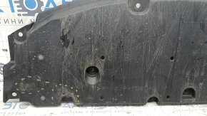 The front bumper guard of a Toyota Prius 50 16-18 is worn, scuffed, and the fastening is broken.