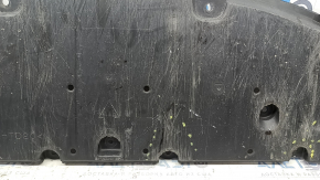 The front bumper guard of a Toyota Prius 50 16-18 is worn, scuffed, and the fastening is broken.