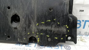 The front bumper guard of a Toyota Prius 50 16-18 is worn, scuffed, and the fastening is broken.