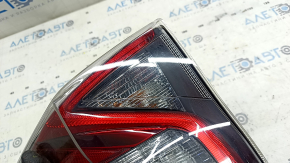 Upper left wing light of Toyota Prius 50 16-18 glass is dirty from the inside, scratches