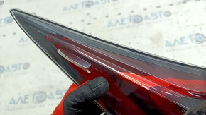 Upper left wing light of Toyota Prius 50 16-18 glass is dirty from the inside, scratches