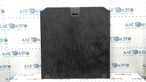 The trunk floor of a BMW X5 F15 14-18 is black and has a broken lock.