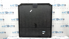 The trunk floor of a BMW X5 F15 14-18 is black and has a broken lock.