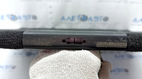 The trunk floor of a BMW X5 F15 14-18 is black and has a broken lock.