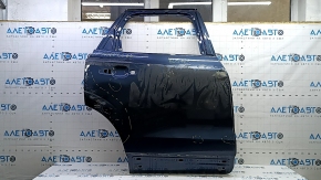 The bare rear right door of a Volvo XC60 18-25 blue 723, dents, bumps