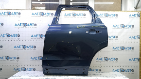 The bare rear left door of a Volvo XC60 18-25 blue 723, dented