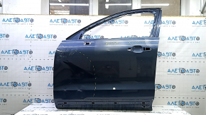 The front left door of a Volvo XC60 18-25 blue 723 is bare and dented.