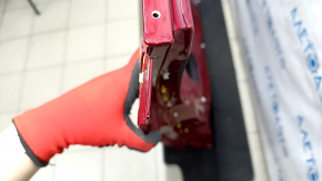 The front left door of a Toyota Venza 21-24 red 3T3 is bare, with bumps and a deformed corner.