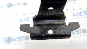 The paint on the right battery mount of a BMW X5 F15 2014-2018 is blistering.