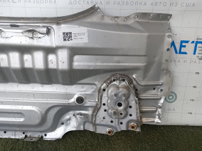 The rear panel of the Toyota Camry v40 is drilled, silver, rusty