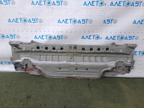 The rear panel of the Toyota Camry v40 is drilled, silver, rusty