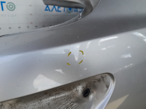 The quarter panel of the rear right Toyota Camry v40 is sawed off, silver, rusty, with bumps.