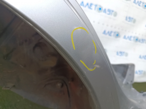 The quarter panel of the rear right Toyota Camry v40 is sawed off, silver, rusty, with bumps.
