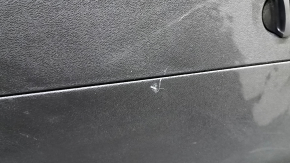 Volvo XC60 18-25 black lower tailgate trim with trim, scuffs, backlit