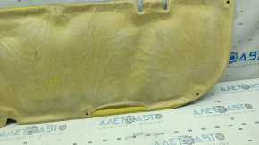 The hood insulation of a Toyota Venza 21-24 is torn, the coating is peeling off on the back side.