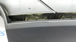 The rear bumper lip of the Audi A4 B8 13-16 restyling sedan, S-Line, gray, is broken, melted, and has scratches.